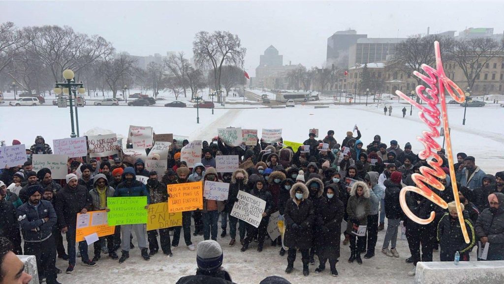 International Workers Protesting to remove Manitoba Government's Risk Factor claiming it is discriminatory